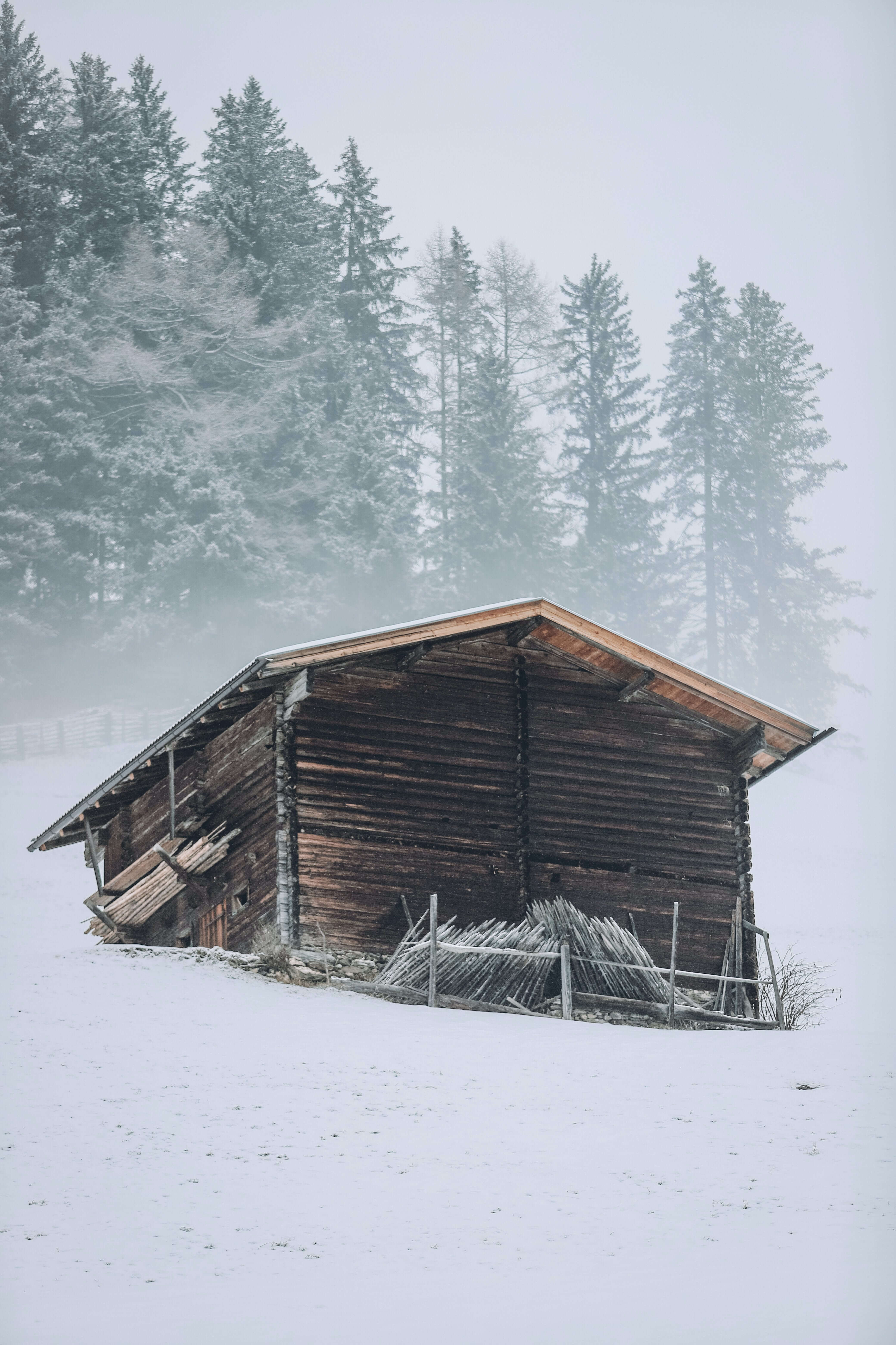 a house in a mountaint covered in snow